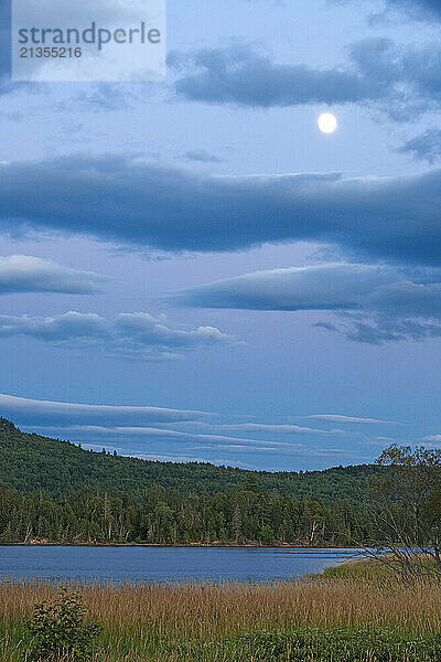 Moonrise over the North Branch of the Dead River in Eustis  Maine.