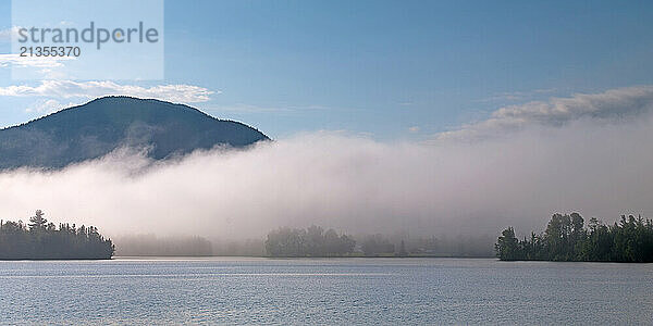 Low lying fog bank separates Flagstaff lake from Cranberry Peak near Stratton  Maine