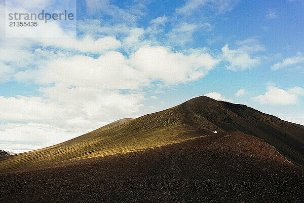 Wedding couple against mountains in Iceland