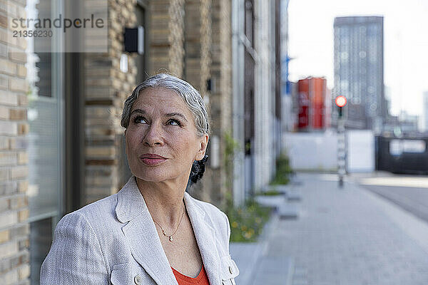 Thoughtful senior woman with gray hair