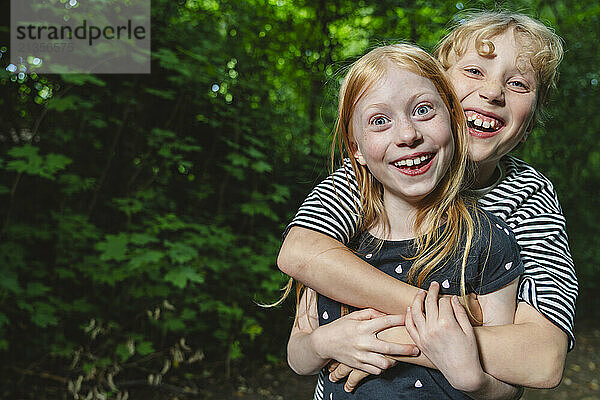 Laughing hugging brother and sister  Hamburg  Germany