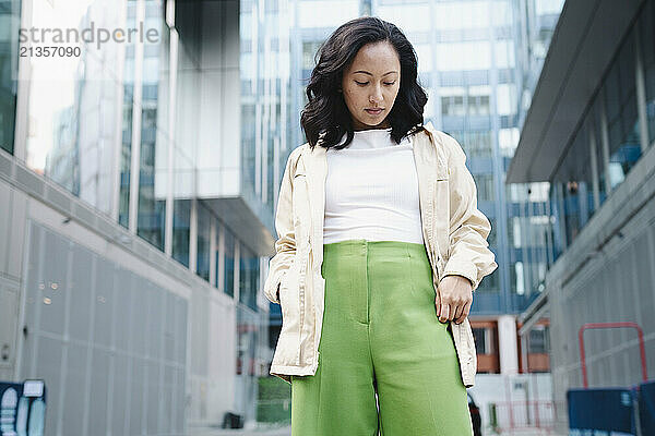 Fashionable woman standing at street