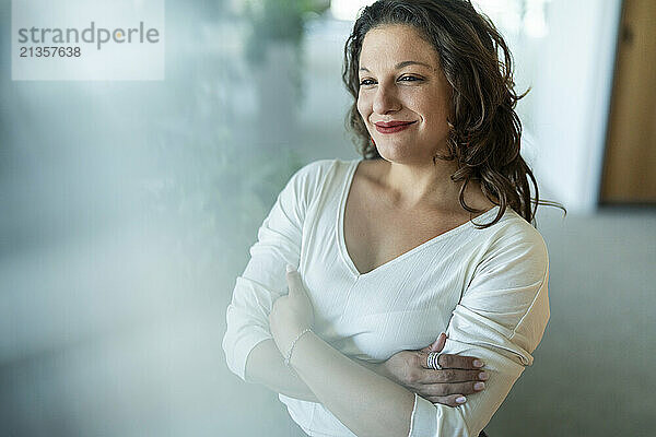 Businesswoman with arms crossed in office