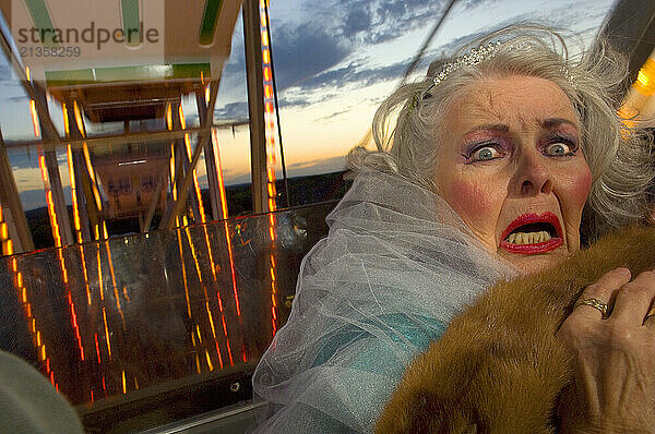 Old woman freaks out on ferris wheel.