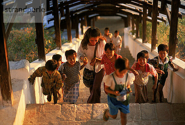 Burmese school children with a new friend