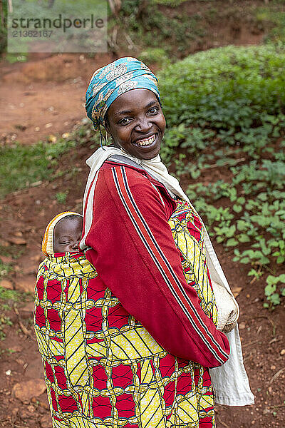 Mother carrying her baby on her back in southern Rwanda