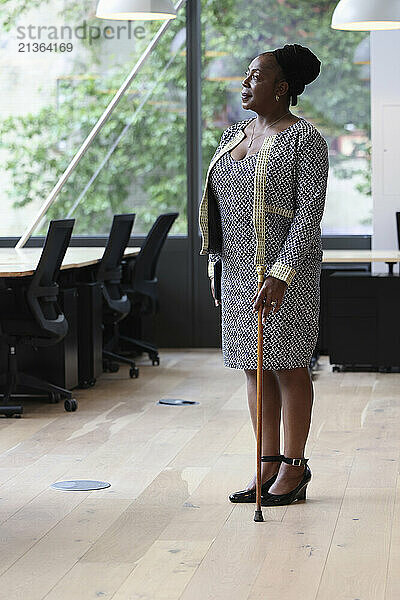 Mature businesswoman standing in office