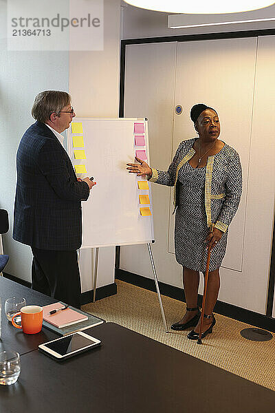 Man and woman during presentation in office