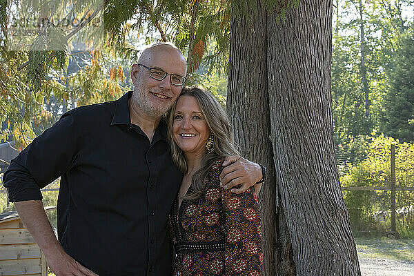 Outdoor portrait of a mature couple in an embrace; Gambier Island  British Columbia  Canada