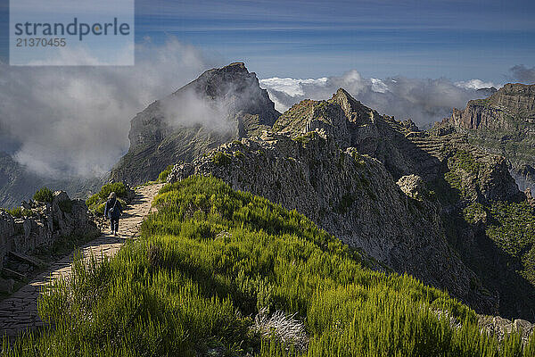 Pico do Areeiro  Madeira island's third highest peak  with the mountain range peaks in the clouds  Portugal; Sao Roque do Faial  Madeira  Portugal