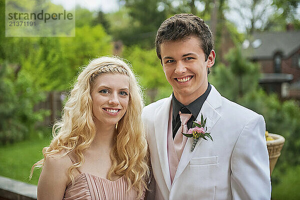 Young couple posing outdoors for prom portrait; Lincoln  Nebraska  United States of America