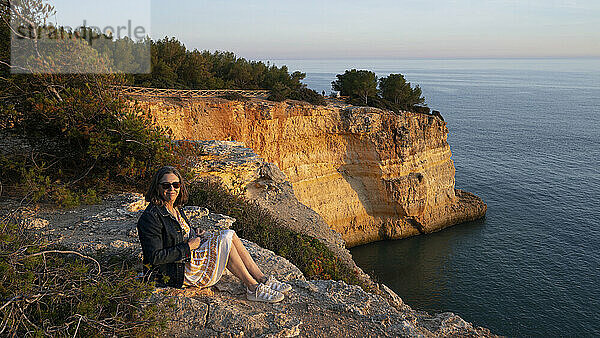 Benagil Beach at sunset  with rugged cliffs along the Algarve coast in Portugal; Benagil  Lagoa  Faro  Portugal