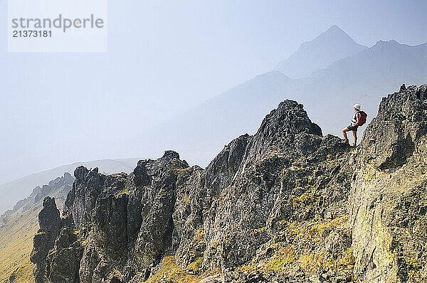 Women hiking Angelcomb Peak in the Ogilvie Mountains of Yukon  Canada; Yukon  Canada