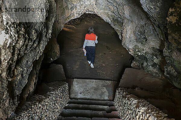 Woman enters the Cave of Lapa de Santa Margarida; Sao Lourenco  Setubal  Portugal