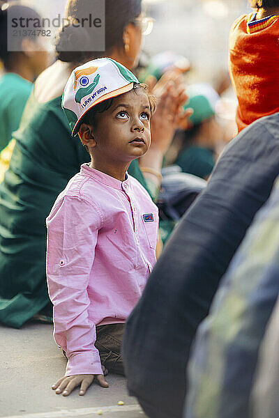 Young girl wears a hat with the message 'I love my India' as she sits in the stands for the ceremony at the Attari - Wagah Border; Attari  Punjab  India