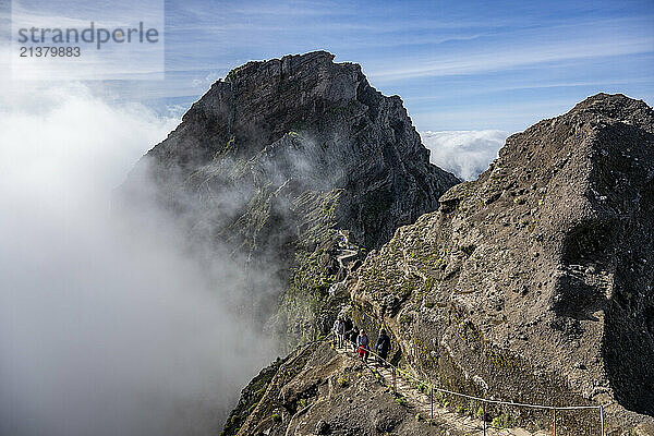 Hikers on the trail on Pico do Areeiro  Madeira island's third highest peak  Portugal; Sao Roque do Faial  Madeira  Portugal