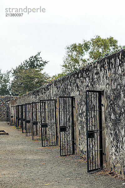 Open doors of the prison cells in a row at the Con Dao Prison in Ba Ria–Vung Tau province  Vietnam; Con Son Island  Ba Ria–Vung Tau province  Vietnam