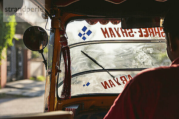 Auto rickshaw and driver in Jaipur  Rajasthan  India; Jaipur  Rajasthan  India