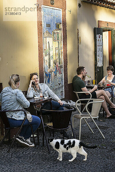 Enjoying outdoor dining in the coastal town of Funchal on the island of Madeira  Portugal; Funchal  Madeira  Portugal