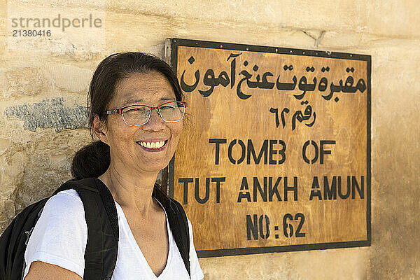 Woman at entrance to Tutankhamon's Tomb  Valley of the Kings  Thebes  Egypt; Thebes  Egypt