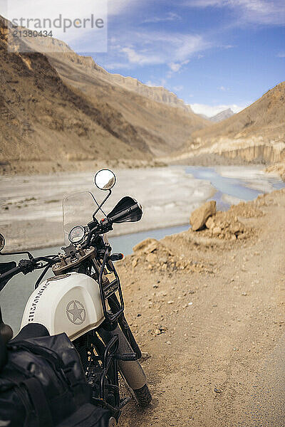 Motorcyle parks along a roadside in a valley of the Himalayas  Himachal Pradesh  India; Himachal Pradesh  India