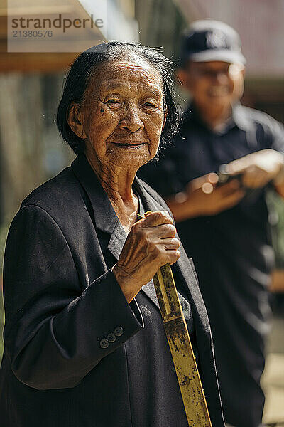 Senior woman attending the Indonesian Rambu Solo ceremony; Rante Pao area  North Toraja  Sulawesi  Indonesia