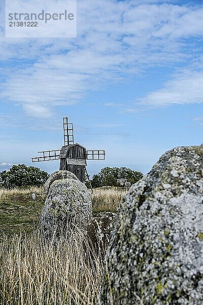 Stone settlement and traditional windmill at the cemetery of Gettlinge (Gettlinge gravfält)  which was used from the Late Bronze Age to the Viking Age  in the south of the island of Öland  Kalmar län  Sweden  Europe