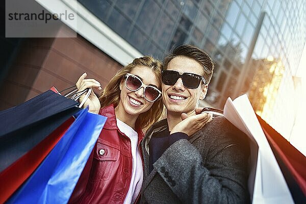 Portrait of a couple with shopping bags in the city.People  sale  love and happiness concept