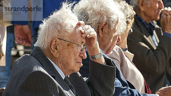 Survivors of the massacre of 3 June 1941  older men in suits sit thoughtfully in a predominantly outside environment  visit of the Federal President Frank-Walter Steinmeier in Kandanos on 31 October 2024  Federal President  Frank-Walter Steinmeier  memorial  war crimes  Nazis  Wehrmacht crimes  World War II  Kandanos  southwest Crete  Crete  Greek Islands  Greece  Europe