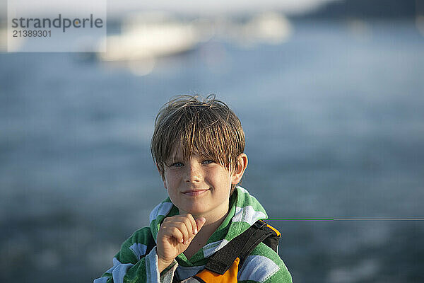 A young boy plays on Swans Island  Maine during his annual family vacation.