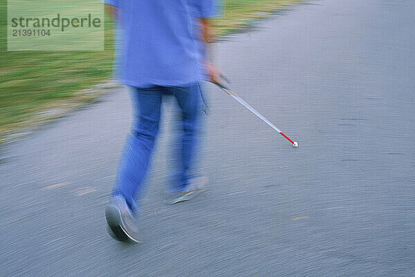 A blind man receiving training at the Alabama Institute for the Deaf and Blind in Talladega  Alabama  uses a cane to navigate a textured sidewalk on the campus. Alabama Institute for Deaf and Blind is the world's most comprehensive education and rehabilitation system serving children and adults who are deaf  blind and multidisabled. Children ages†3 to 21 are served through Alabama School for the Deaf  the Alabama School for the Blind and the Helen Keller School of Alabama  accredited residential programs. E.H. Gentry Technical Facility is an accredited two-year technical school for adults who are deaf or blind or who have multiple disabilities. Alabama Industries for the Blind gives meaning and substance to the lives of visually impaired adults through employment opportunities in Talladega and Birmingham.