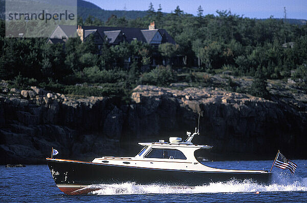 A Hinckley Picnic boat cuts through the water near Southwest Harbor  Maine.