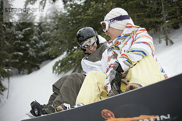 A snowboard couple at Sunday River Ski resort in Bethel  ME.