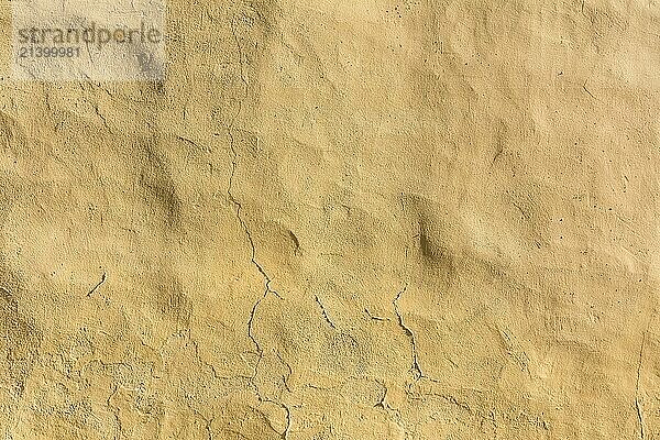 Background yellow  beige plastered wall