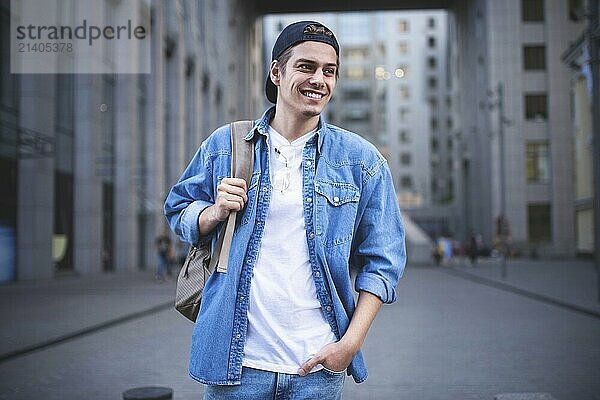 Background on the street while waiting his colleagues. Businessman wearing casual white shirt and spectacles. People