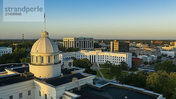 Golden sunlight reaches the horizon showing around the capital statehouse in Montgomery Alabama