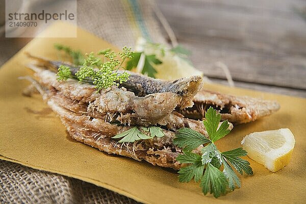 Presentation of a seafood platter  fried anchovies