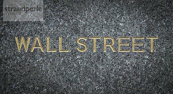 A Gold Engraved Sign For Wall Street In New York City (NYC) On Marble