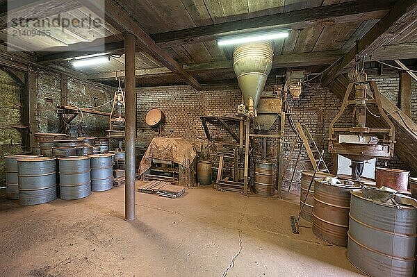 Metal barrels in the bronze powder filling room of a metal powder mill  founded in 1900  Igensdorf  Upper Franconia  Bavaria  Germany  Europe