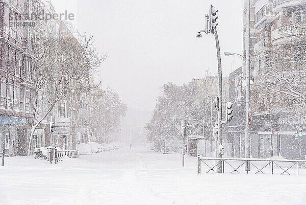 Madrid  Spain  January 9  2021: View of a stree of the covered in snow during heavy snowfall. Storm Filomena in Madrid. Lopez de Hoyos Street  Europe