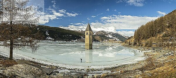 Panorama shot of flooded church tower in Lake Reschen (Reschensee) in South Tyrol  Italy  Europe