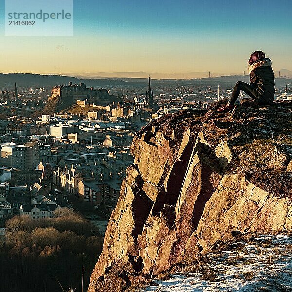 A Girl Overlooking The Beautiful Edinburgh Skyline And Castle During A Winter Sunset