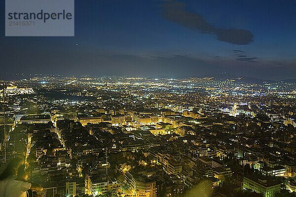 Great city Athens at night. Amazing city lights and Blue sky  Good place to tranquility from Filothei hill