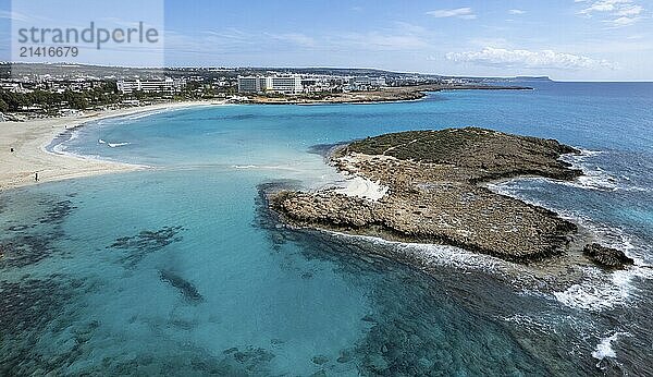 Aerial drone view of the coastline of empty beach in winter. Summer holidays. Nissi beach bay Ayia Napa  Cyprus  Europe