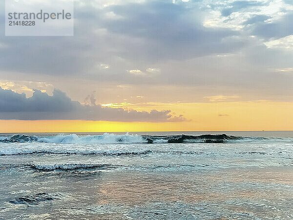 Amazing sunset view on Indian ocean from Suluban beach at Bali  Indonesia  Asia