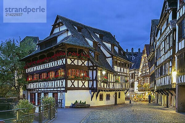 Street with historical half-timbered houses in Petite France district with Maison des Tanneurs (tanners house)  Strasbourg  France. Evening