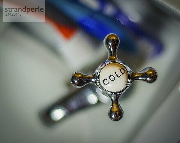 Detail Of A Rustic VIntage Cold Faucet And Toothbrushes On A Wash Basin