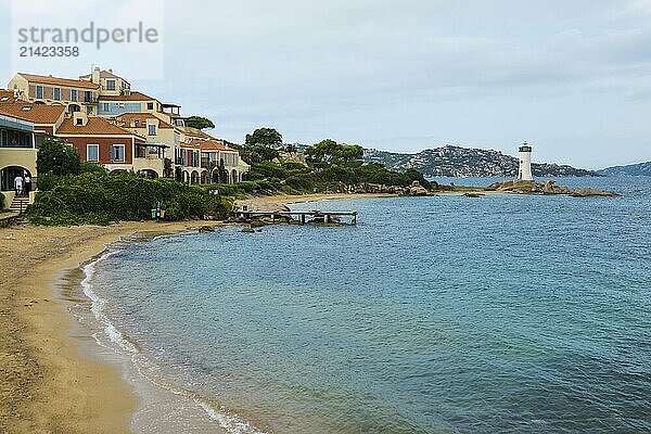 Lighthouse with beach and colourful houses  Spiaggia Porto Faro  Faro di Punta Palau  Palau  Costa Smeralda  Sardinia  Italy  Oceania