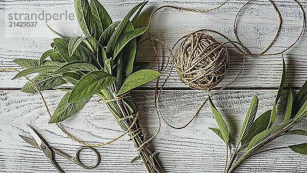 Sage bundle on wooden background  sage herb picked for medicinal and culinary use  overhead view