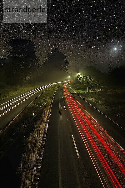 Night Image of Cars on a Highway Under the Stars